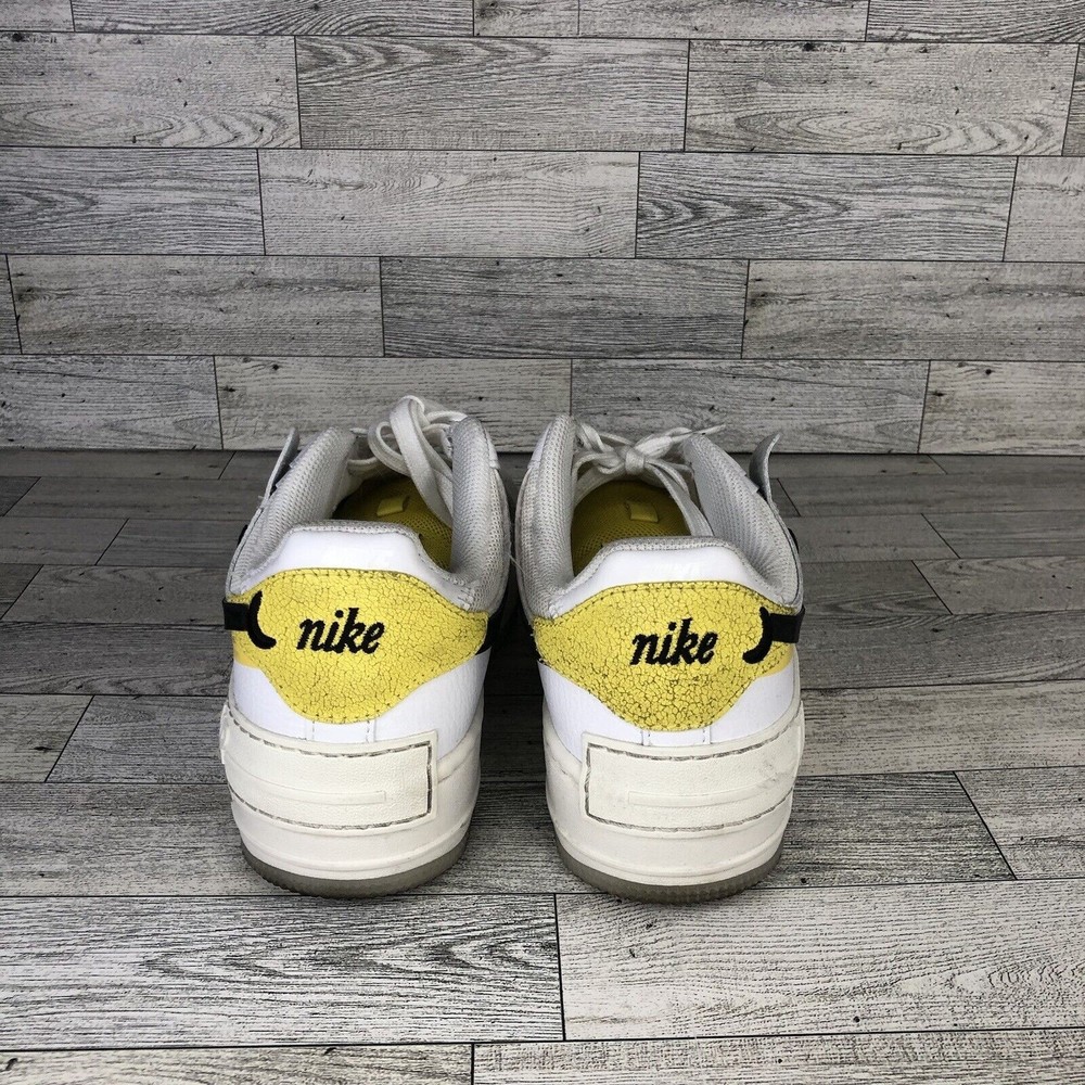 Nike White and Black Athletic Shoes with Yellow Accents - Picture 3 of 5